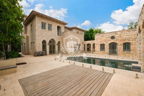 Stunning and jaw-dropping villa for sale on a quiet, tree-lined street in the heart of Savyon, crafted from Jerusalem stone- using techniques and materials impossible to replicate- a one-of-a-kind masterpiece! The home is located on one of Israel’s r...