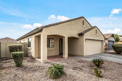 Live in vibrant Buckeye! Move-in ready home with loads of special features! SOLAR, new luxury vinyl wood plank floors and neutral tile, plantation shutters, surround sound in great room, and lots of storage in this popular split floorplan. The ensuit...