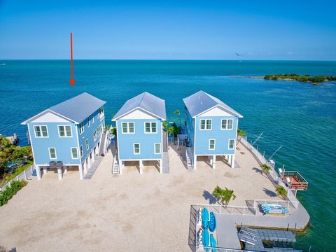 Welcome to 7 Mile Point, where luxury and breathtaking Gulf views come together in perfect harmony. This newly built 5 bed 3.5 bath coastal masterpiece is designed to elevate your island lifestyle. Every detail, from its thoughtfully curated design t...