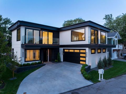 Stylish modern design on Lake Minnetonka. This exquisite home features clean architectural lines and walls of glass flooding the interior with natural light. High-end finishes, an open design and extensive LED lighting set the mood while seamlessly c...