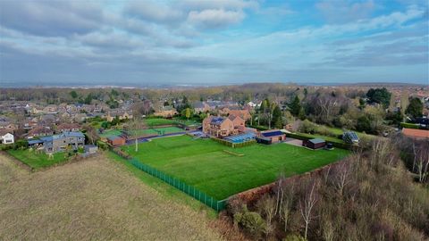 A spectacular home occupying a private tucked away position, set within stunning 3-acre grounds, enjoying south facing gardens, breathtaking scenic views, a leisure suite incorporating a swimming pool, tennis courts, putting green and football pitch ...