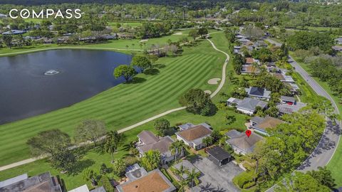 Beautifully Situated on the 18th Hole w/ Lake Views! Best Deal for a Single Family Home w/ Membership Options in Palm Beach Gardens. This Incredible Opportunity Features 2 Bedrooms, 2 Full Bathrooms, Den, Golf Cart Garage, Golf Cart, Outstanding Open...