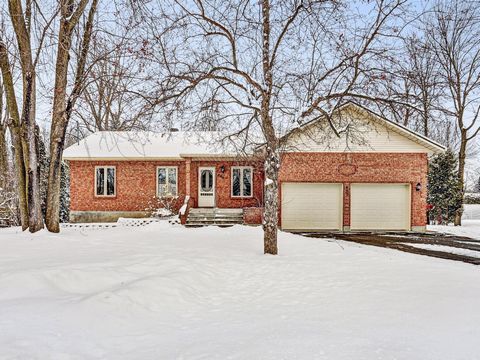 IMPECCABLE! 4 sided brick bungalow offering you an open concept 1st floor, 3 good size bedrooms, living room with a gas fireplace, kitchen with granite counter tops, dining room giving on the solarium, wall mounted heat pump, large partially finished...