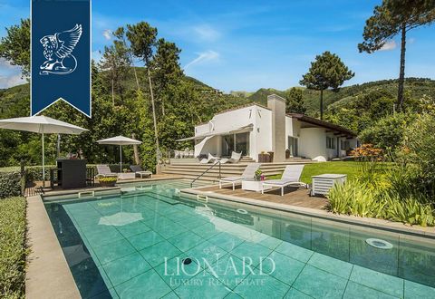 This luxury house for sale, located in Camaiore, not far from the Tuscan sea in the province of Lucca, is surrounded by a garden of pines, Mediterranean vegetation and olive trees. The estate, with an external surface of almost 3,000 sq m, includes a...