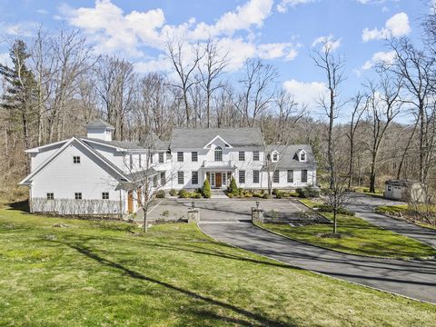 Tucked into the woods is a stately colonial on 3 acres. Spectacular views of professionally landscaped property & tranquil fishing pond. Elegance abounds w/ detailed moldings, graceful arches & French doors allowing sunlight to flood the home. Stunni...