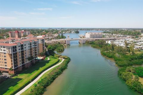 PRICE REDUCED! Experience the best of Florida living in this beautifully renovated, waterfront condo conveniently located behind the private gates of 