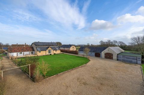 Rurally set in the Wiltshire hamlet of Allington, within six acres of land, this stunning Cotswolds barn conversion strikes the perfect balance between country living and contemporary comfort. Featuring six bedrooms, two en suite, and versatile livin...