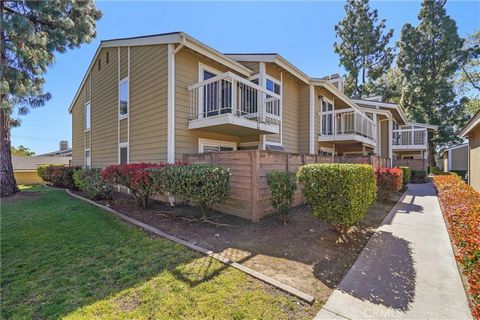 Beautifully remodeled and maintained single level end unit townhome in a quiet complex in the community of San Dimas. Custom tiled entry leads to a spacious living room with corner fireplace, wide planked flooring and adjacent balcony with lovely mou...