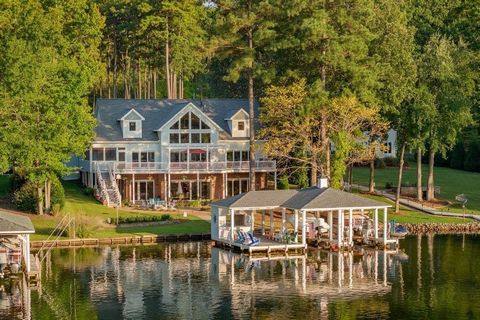 Luxury lake house dreams do come to true at 54 Stonecrop Circle. This rare offering features 6037 square feet, 4 bedrooms, 3 flex rooms, 5 full, & 1 half bath spread across 3 levels. Upscale & timeless features include: Pella windows w/ built in blin...