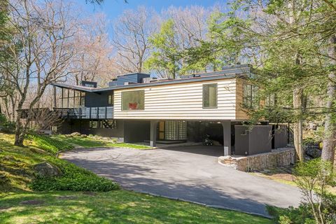 NOTED ARCHITECT DAVID HENKEN DESIGNED THIS HOME in 1957 EMBRACING THE UNION OF LANDSCAPE & ARCHITECTURE. Nested atop a private zen-like oasis you immediately understand Henken's genius of using the natural topography while conceptualizing the moderni...