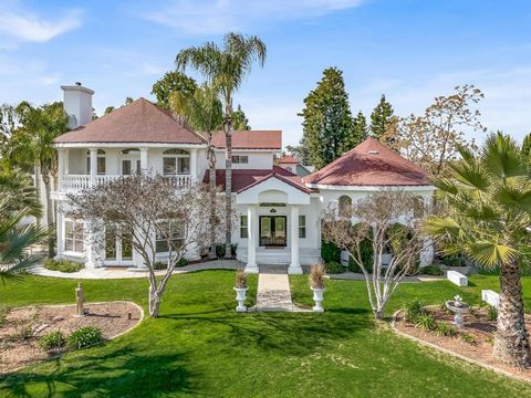 Grand One Acre Country Estate with Panoramic views of the Sierras. Elegant entry features custom pillars and beautiful etched glass doors. You will love the Unique spacious Circular Living room, 14-foot ceilings and multiple arched windows with views...