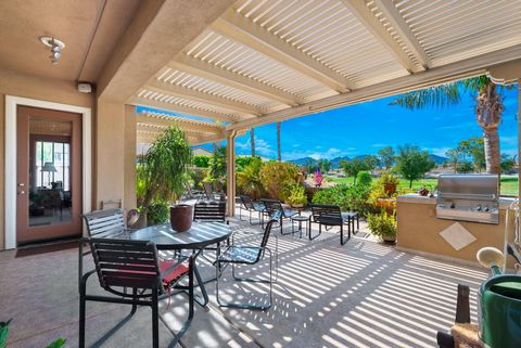 Discover the meticulously maintained Oreas plan, nestled next to the #10 green in the prestigious 55+ Trilogy La Quinta community, renowned for its resort-style amenities. This residence captivates from the start with an impressive Tuscan facade and ...