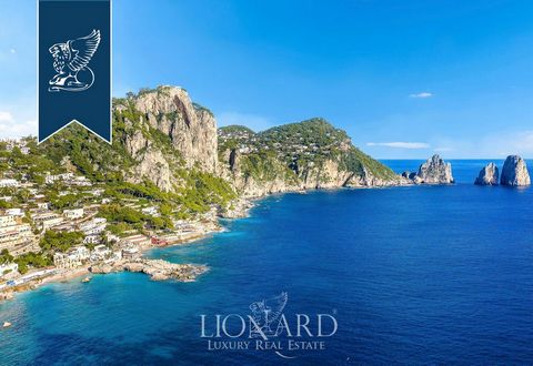 For sale on the enchanting island of Capri, this beachfront luxury flat in Marina Piccola offers a 100 sqm modern estate with 2 bedrooms, 2 bathrooms, and a spacious outdoor terrace. Recently renovated, the flat features an open-plan area with a brig...