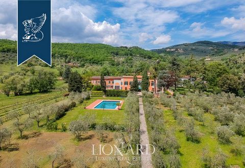 This lovely period estate for sale is situated in the heart of Tuscany, at the foot of Pistoia's hills and just a thirty-minute drive from Florence. Inside the main villa, which encompasses eight bedrooms, seven of which possess a private bathro...