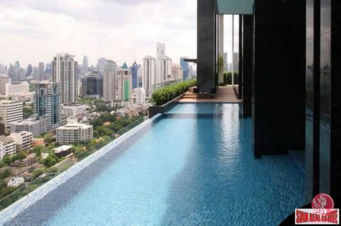 This is a very nice two bedroom, two bath condo for sale in the Nara 9, only 700 m. to BTS Chong Nonsi. The unit has a big open living space with a living room that opens out to a small balcony and sitting area. The living room has a sofa, coffee tab...