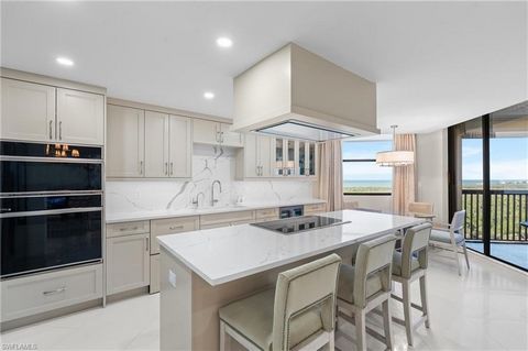 Perched high on the 12th floor of the exquisite Dorchester in Pelican Bay, this meticulously 2023 remodeled residence presents a unique opportunity to embrace the finest in Naples living. Bathed in natural light, this unit exudes modern elegance, fea...