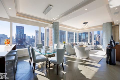 Stunning, triple mint, and custom 3 bedroom, 3 bathroom condominium perched above Billionaire's Row with open City views and light from every room! This beautiful home is a rare blend of new construction with famous designer upgrades. Step into a for...