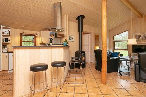 Large and spacious holiday cottage with bright, modern furnishings located on a level natural plot partly surrounded by trees and bushes in a popular cottage area approx. 1000 m from the ocean and beach. Open concept kitchen and living room, 4 bedroo...