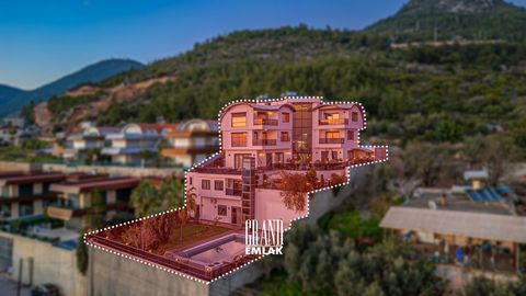 This striking mansion, situated on a 1,100 m2 plot of land in Alanya, boasts a generous 750 square meter floor area spread across 3 levels, offering an enchanting vista of the sea. Perched atop a hill, nestled against the forest, it provides a lofty ...