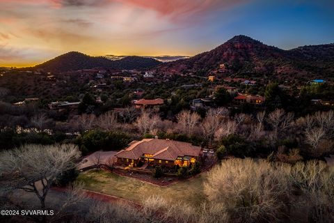 Creekside estate with red rock views in an upscale private gated subdivision surrounded by National Forest and the free flowing waters of Oak Creek. Ideal shady getaway with an open path down to the creek and a swimming hole directly behind the home....