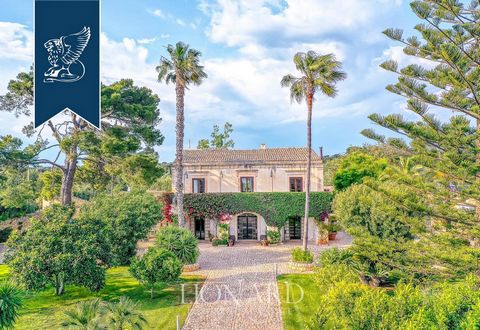 A few minutes from the beautiful Scicli, a Baroque town that is part of the UNESCO World Heritage List, there is this enchanting property with a 8,800-sqm park, 5,000 sqm of which feature olive groves and 3,800 sqm a perfectly-maintained private gard...