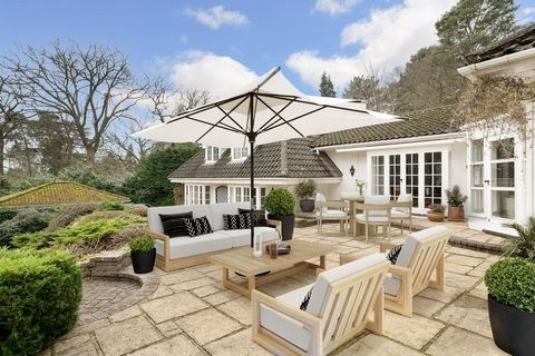 High Acre, nestled in the heart of the prestigious Wentworth Estate, is a rare gem situated on a private mature plot. This beautiful four-bedroom home exudes character and offers spacious accommodation across two floors, making it perfect for both en...