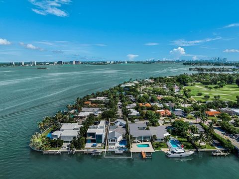 Your dream home awaits you in Miami Isles! Magnificent beachfront home in a gated community with security, within walking distance to the golf course. Stunning contemporary 2-story architecture, this home features 6 bedrooms/5+1 bathrooms, open plan ...
