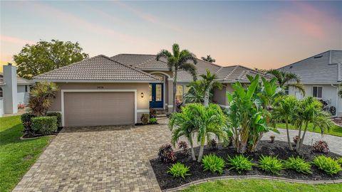 Located in Punta Gorda Isles in the highly desirable boating community of section 12, experience the epitome of waterfront luxury living in this meticulously crafted 4-bedroom home, boasting effortless sailboat access to Charlotte Harbor and the Gulf...