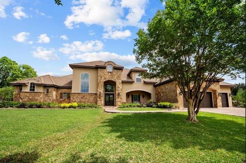 Stunning 16-acre gated luxury ranch w/custom built estate, barns, stalls, & a spring-fed pond. Luxury estate brimming with amenities & space nestled in Wildwood Estates! The grand foyer opens to family room & panoramic backyard views. Oversized famil...
