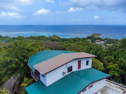 Welcome to the duplex, Villa Anna in Jungle Reef Villas in the heart of Sandy Bay, with views that will take your breath away. Villa Anna offers 3 bedrooms and 2 bathrooms, a spacious open concept living area that has a wrap-around porch giving you s...