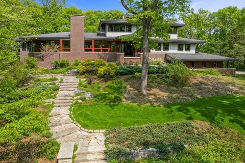 Spectacular hilltop home blends extreme quality and craftsmanship with style, comfort and easy living located on peaceful and private wooded site with tennis court. Timeless design created by Rehkamp Larson architects built by Dovetail with unmatched...