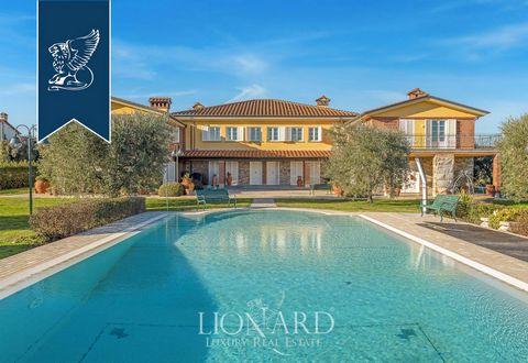 Enchanting luxury villa for sale set in the sweet hills of Montecarlo, in the province of Lucca, a place of rare beauty famous for its fine wines and its historic road of wines. This exclusive property develops on an internal area of ​​1000 square me...
