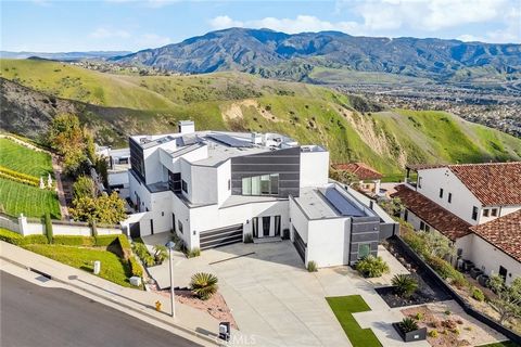 Nestled within the prestigious enclave of Hidden Hills, this unparalleled ultra-modern masterpiece redefines luxury living and showcases the pinnacle of contemporary design. Situated atop a private nearly ¾ acre lot, this home offers breathtaking vie...