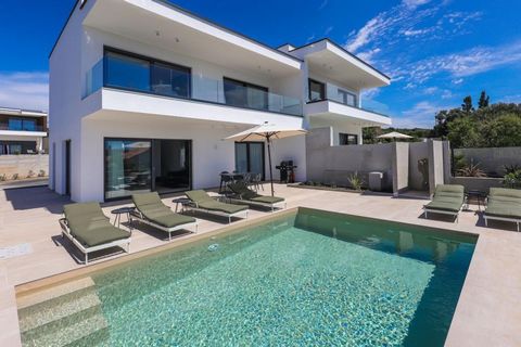 Exceptional modern duplex villa with pool on Pag island (peninsula), 150 meters from the sea only! Total surafce is 144 sq.m. Land plot is  758 sq.m. We are selling this beautiful modern villetta as a part of contemporary villas complex, where each w...