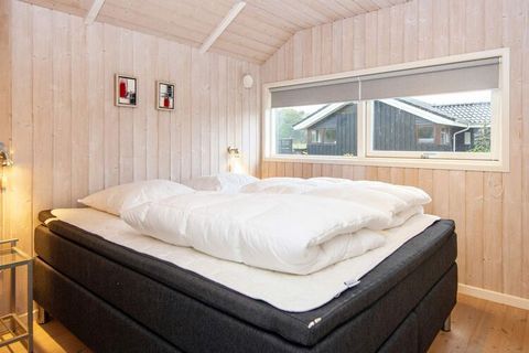 Holiday cottage with panoramic view of the lake. Practical and tasteful furnishings with interesting deatils signifies this house with modern comfort. After an active day you can relax in the whirlpool or sauna. There is a ban on fishing in Kvie Sø b...