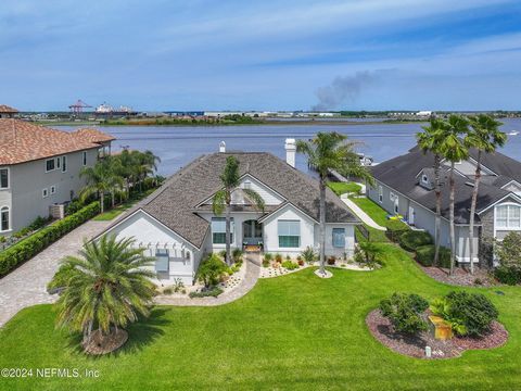Price Reduced!!! OPEN HOUSE Sunday, April 28th 2-4! Truly an exquisite, fully-remodeled & move-in ready, riverfront, custom Arthur Rutenberg pool-home that includes dock & two boat slips (5k & 10k lbs.)! This is a boaters' dream home with panoramic S...