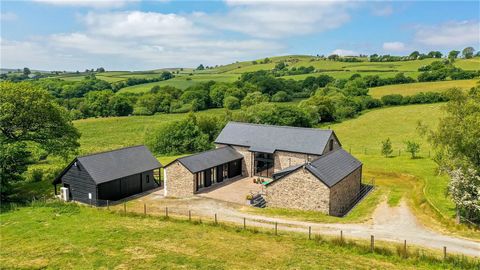 Indulge in the epitome of countryside charm with this exquisite 4/5 bedroom contemporary barn conversion, nestled in an idyllic rural location offering breathtaking panoramic views. Blending period features with modern sophistication, this home exude...