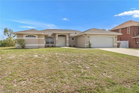 Step into this enchanting residence nestled in the heart of NE Cape Coral. Located in a highly sought-after neighborhood, this exquisite home offers a seamless combination of comfort, style, and convenience. Upon entering, you'll be greeted by soarin...