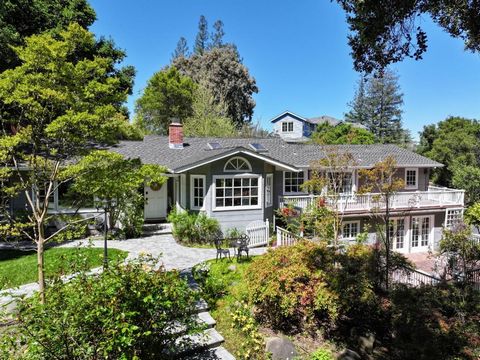 Welcome to this stunning English cottage style home in the desirable South Kennedy neighborhood. Located on a quiet cul de sac, set amongst mature trees, the approximately 1.2 acres create a park-like setting with the charm of a secret garden. Let th...