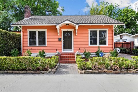 Adorable and historic 3 bedroom 2 bathroom home located on the cutest street in the fabulous Lake Eola Heights neighborhood of downtown Orlando. As you walk into the living room you will notice the original hardwood floors, wood burning brick firepla...