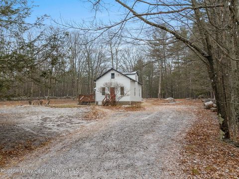 Charming Cape nestled on a spacious one acre, level lot surrounded by stone outcroppings. This delightful home offers a perfect blend of comfort and convenience, with its quiet setting providing a sense of tranquility. Inside, the Cape features a coz...