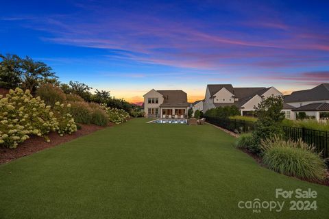 Welcome home to this stunning modern English farmhouse! Prepare to be wowed by the luxurious designer finishes and impeccable attention to detail from the moment you walk in the door. White oak floors lead you through this bright & airy open floor pl...