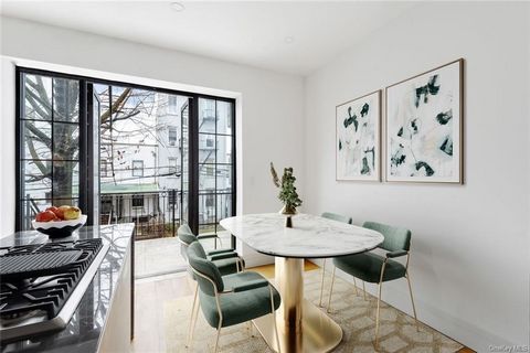 Exquisite Renovated Townhouse in Bedford-Stuyvesant: Luxury Living, Prime Investment OpportunityNestled in the vibrant Bedford-Stuyvesant neighborhood, this meticulously renovated three-family townhouse presents opulent interiors, secluded outdoor re...