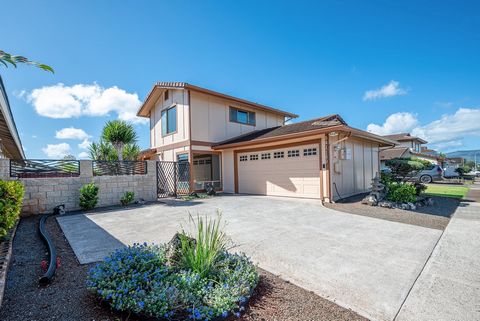 Welcome to your forever home in the heart of Waipio Gentry! This charming single-family residence is a perfect blend of comfort, style, and functionality. Be greeted by vaulted ceilings, a freshly painted interior, brand new carpeting, and a comforta...