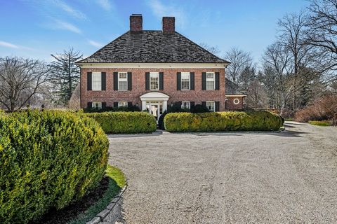 Exquisite sunlit 5 bedroom brick Georgian with slate roof is set down a long driveway on 2.53 acres in midcountry on Round Hill Road. Double height entry with polished limestone floor opens to a lovely living room with coffered ceiling, formal dining...