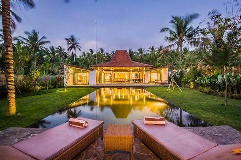 Discover the allure of this enchanting traditional Balinese beachfront villa nestled in the serene locale of Melaya, northwestern Bali. Constructed in 2015, this residence boasts a coveted rental license, promising a lucrative income stream for its p...