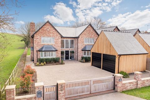 Beautifully presented contemporary residence with open field views in 0.44 acres. Stepping inside, a spacious entrance hall with a galleried landing is flooded with light through the double-height glazing. This elegant and contemporary entrance sets ...