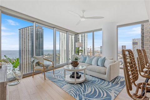 Your home in the sky awaits and you deserve it all! Make your dreams come true on the 25th floor of the coveted Ae’O building with this stunning 3 bedroom, 3 bathroom, condo and enjoy living in the heart of Kaka'ako. Experience the ocean and city vie...