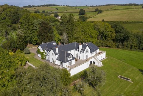 This luxurious country house, nestled in the Monmouthshire countryside, has seven spacious bedrooms, elegant Georgian-style reception rooms, a stunning kitchen/family room and breathtaking views of the beautiful Usk Valley from its balustraded terrac...