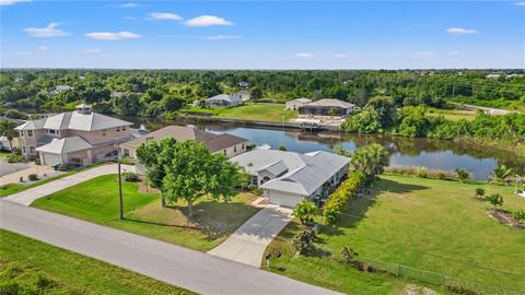Welcome to your waterfront oasis! This charming 4-bedroom, 2.5-bath canal front home is a hidden gem, nestled on the serene waters of the Peace River. Boasting 2,300 square feet of living space, this residence offers a perfect blend of tranquility an...
